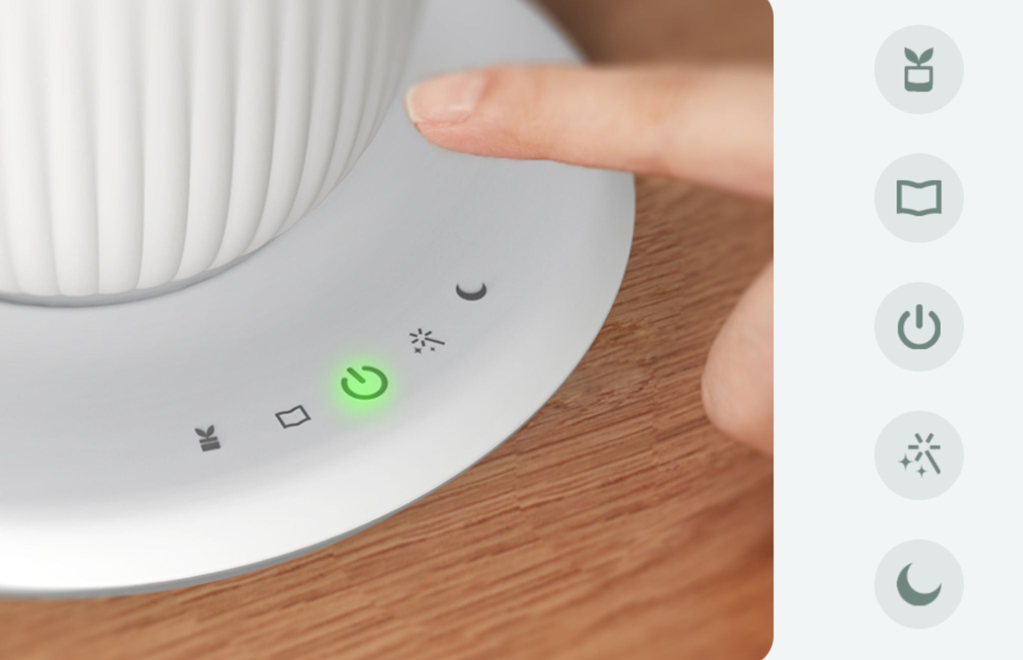 A hydroponic system’s power button is activated, glowing green.