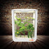 Tall indoor hydroponic system with multiple tiers growing cucumber under LED lighting in a controlled environment.