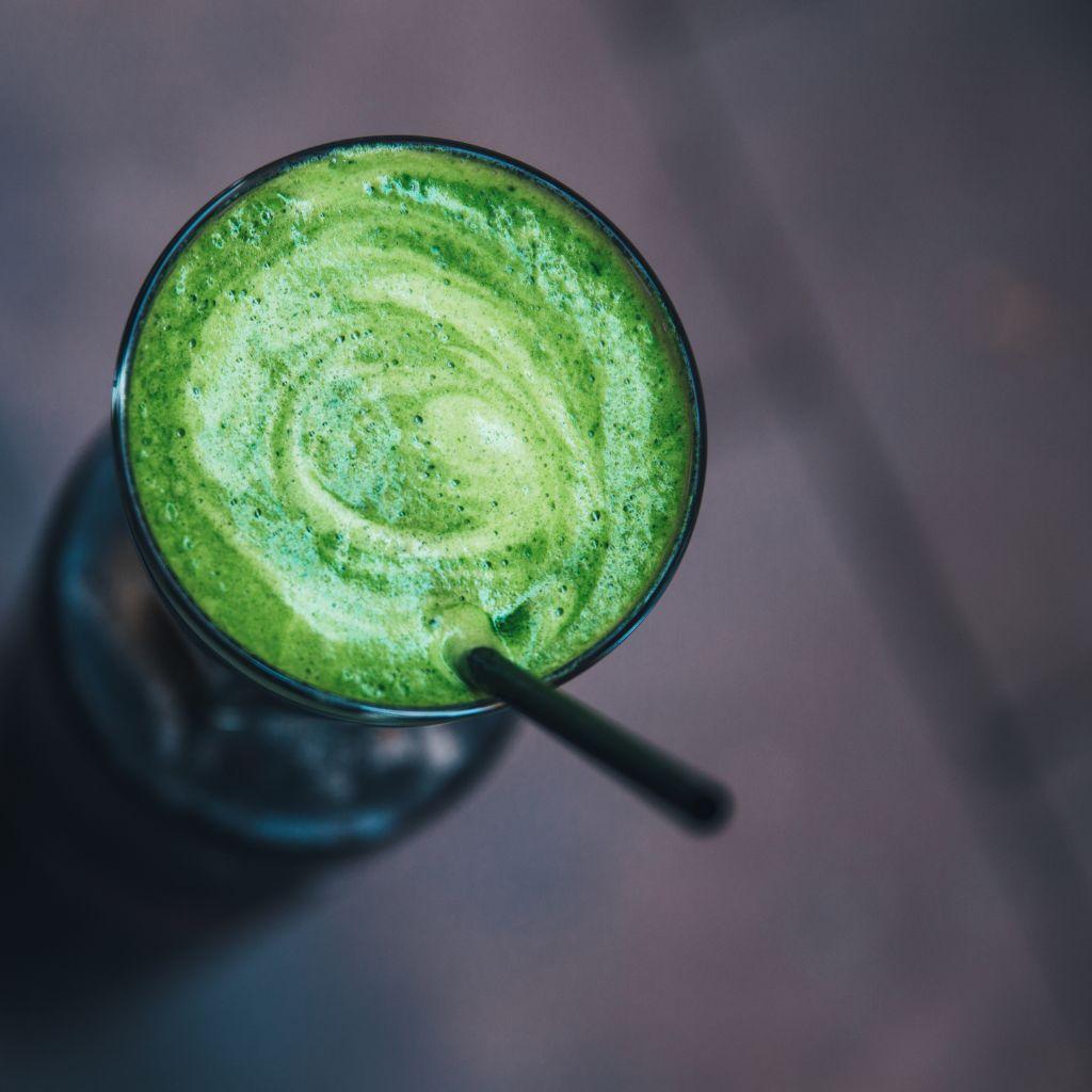 Nutrient-rich green smoothie with blended spinach, banana, and almond milk.
